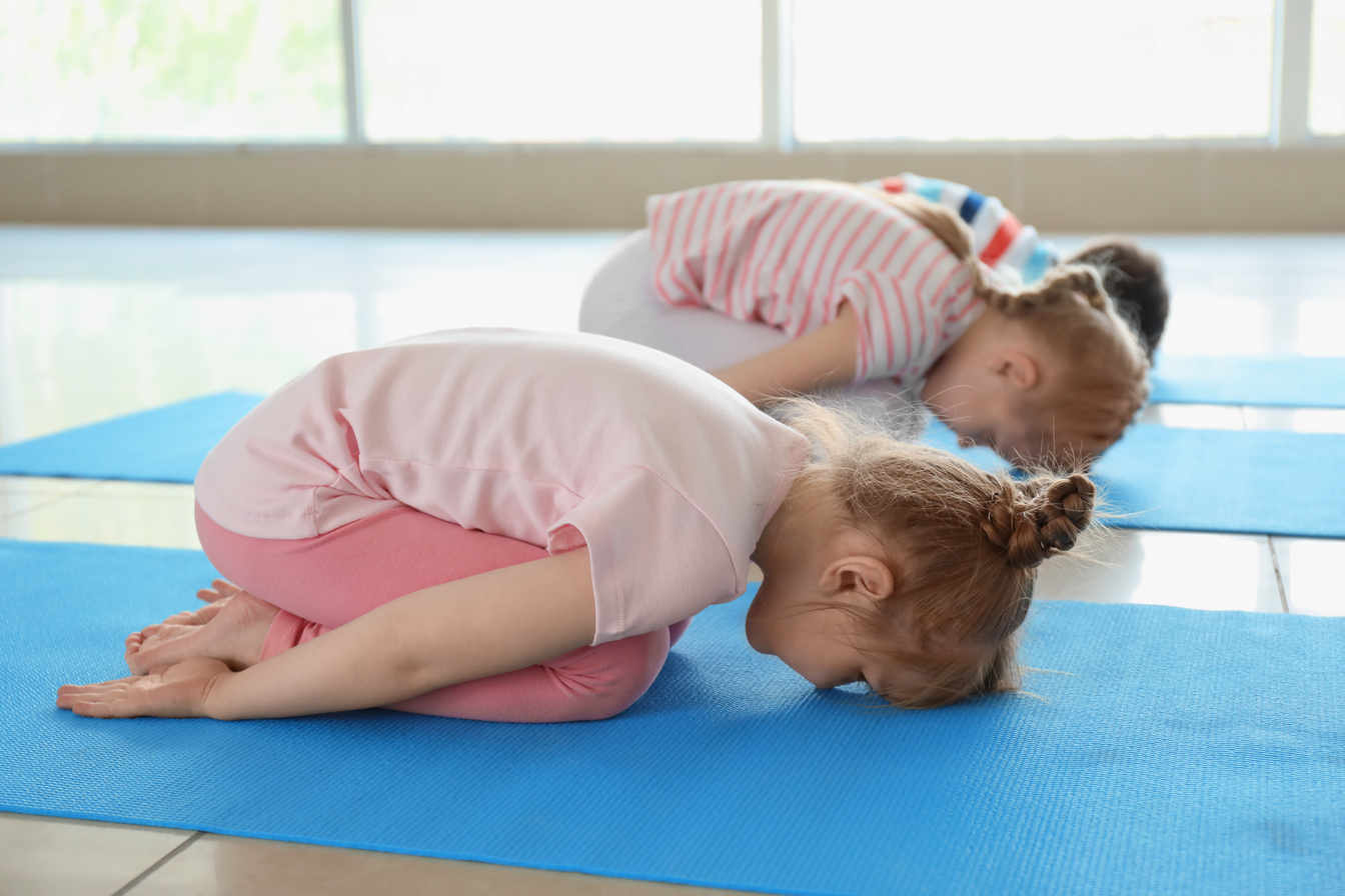Little Children Practicing Yoga Indoors